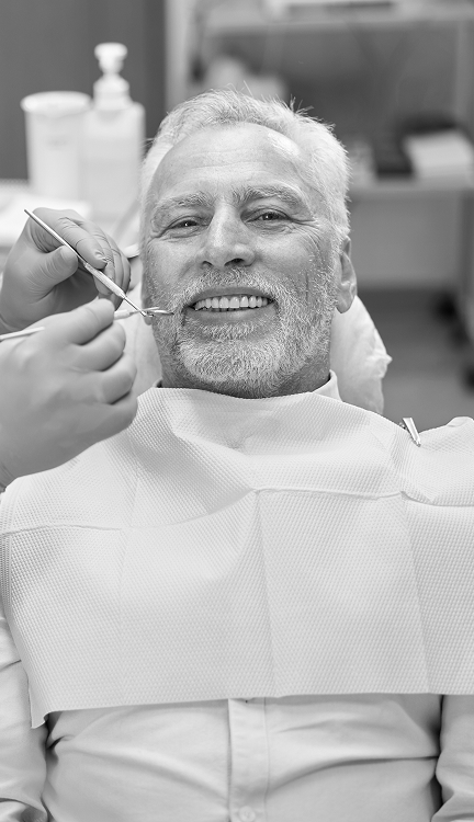 Senior patient receiving a gentle dental cleaning